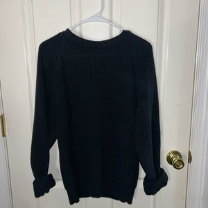 Woman’s black sweater